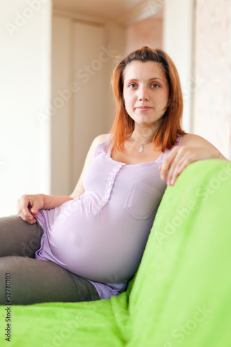 Photo: pregnant woman on sofa pregnant woman on sofa