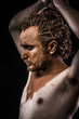 Ancient warrior covered in mud, closed eyes