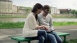 Vídeo: Happy young couple with tablet computer in the city Happy young couple with tablet computer in the city
