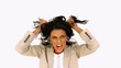 Stressed businesswoman shaking her hair
