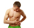 Young man with belly-aches isolated on white background