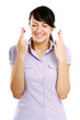 Portrait of superstitious young female with crossed fingers
