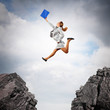 Young businesswoman jumping