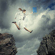 Young businesswoman jumping