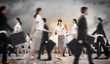 Businesswoman in blindfold among group of people