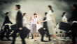 Businesswoman in blindfold among group of people