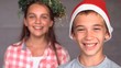 Video: Smiling siblings with christmas hat Smiling siblings with christmas hat