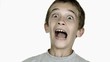 Boy grimacing against white background