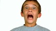 Boy grimacing against white background