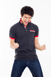 Young Asian man showing fist and happy sign.