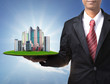 business man and real estate in hand