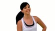 Fit woman tossing her hair and smiling