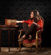 Photo: beautiful young woman tuning in beautiful young woman tuning in