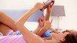 Friends looking at tablet and laughing