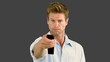 Vídeo: Man using remote on grey screen Man using remote on grey screen