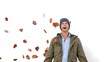 Vidéo : Amazed man looking at falling leaves on white screen Amazed man looking at falling leaves on white screen