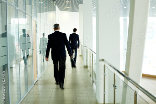 Photo: Walking along corridor Walking along corridor