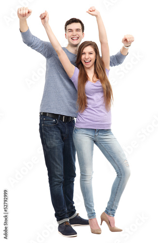 Photo: Young people with arms raised Young people with arms raised