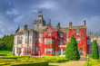 Adare castle in red ivy and gardens, Ireland