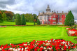 Photo: Adare castle in red ivy and gardens, Ireland Adare castle in red ivy and gardens, Ireland