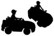 Vector: Silhouettes of small boy "driving" toy car Silhouettes of small boy "driving" toy car