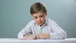 left-handed child , boy draws