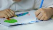 left-handed child , boy draws