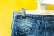 Row of hanged blue jeans in a shop
