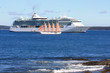 cruise ship and a yacht with pink sails