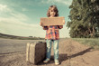 Lonely girl with suitcase
