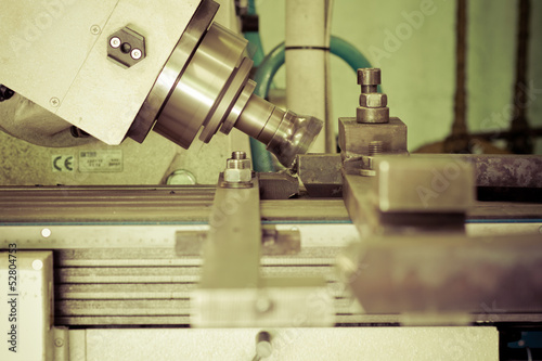 Photo: CNC drilling and miling in a workshop CNC drilling and miling in a workshop