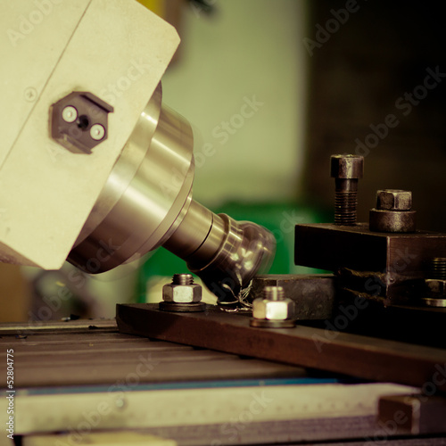 Photo: CNC drilling and miling in a workshop CNC drilling and miling in a workshop
