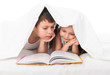 childs read a book in bed