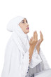Photo: Beautiful muslim woman praying on white Beautiful muslim woman praying on white