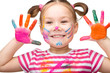 Photo: Portrait of a cute girl playing with paints Portrait of a cute girl playing with paints