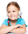 Photo: Young girl is working as an operator at helpline Young girl is working as an operator at helpline