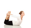 Gymnast girl in flexible back pose, isolated on white background