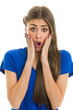 Beautiful young lady looking shocked over white background