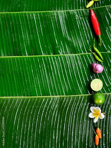Photo: Spices with plumeria.frame.banana leaf background Spices with plumeria.frame.banana leaf background