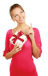Woman holding gift box isolated on white background