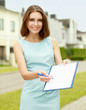 Female architect standing with folder