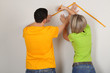 Photo: Young couple moving in new house Young couple moving in new house