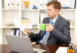Young businessman at lunch break in office