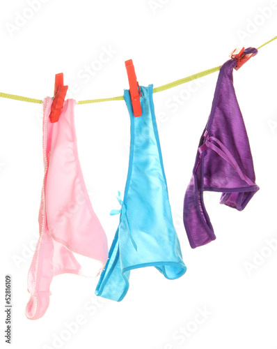 Photo: Women's panties hanging on rope isolated on white Women's panties hanging on rope isolated on white