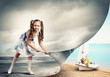 Little girl turning page