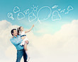 Father holding on hands daughter