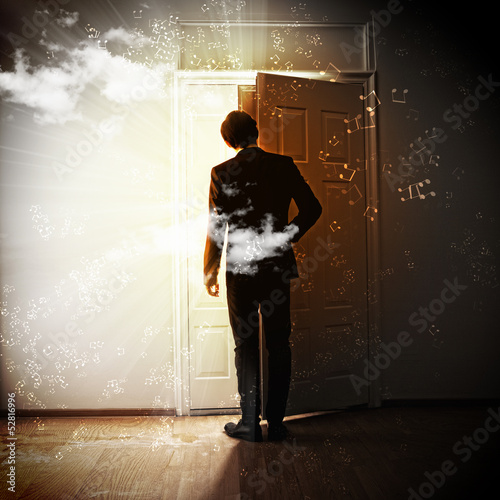 Photo: Young businessman opening door Young businessman opening door