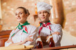Portrait of two cooks with crossed arms