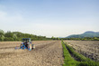Tractor plowing field