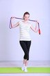 Foto: Beautiful young woman with skipping rope Beautiful young woman with skipping rope